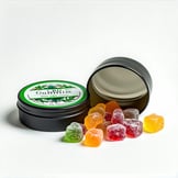 The first tin of CBD gummies is a sleek upright puckshaped container its smooth surface gleaming in the light adorned with vibrant eyecatching labeling that highlights its natural ingredients and benefits In contrast the second tin is also puckshaped-1