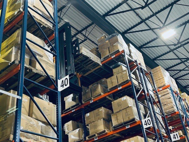 Palletized cartons stored in warehouse racks at KSP