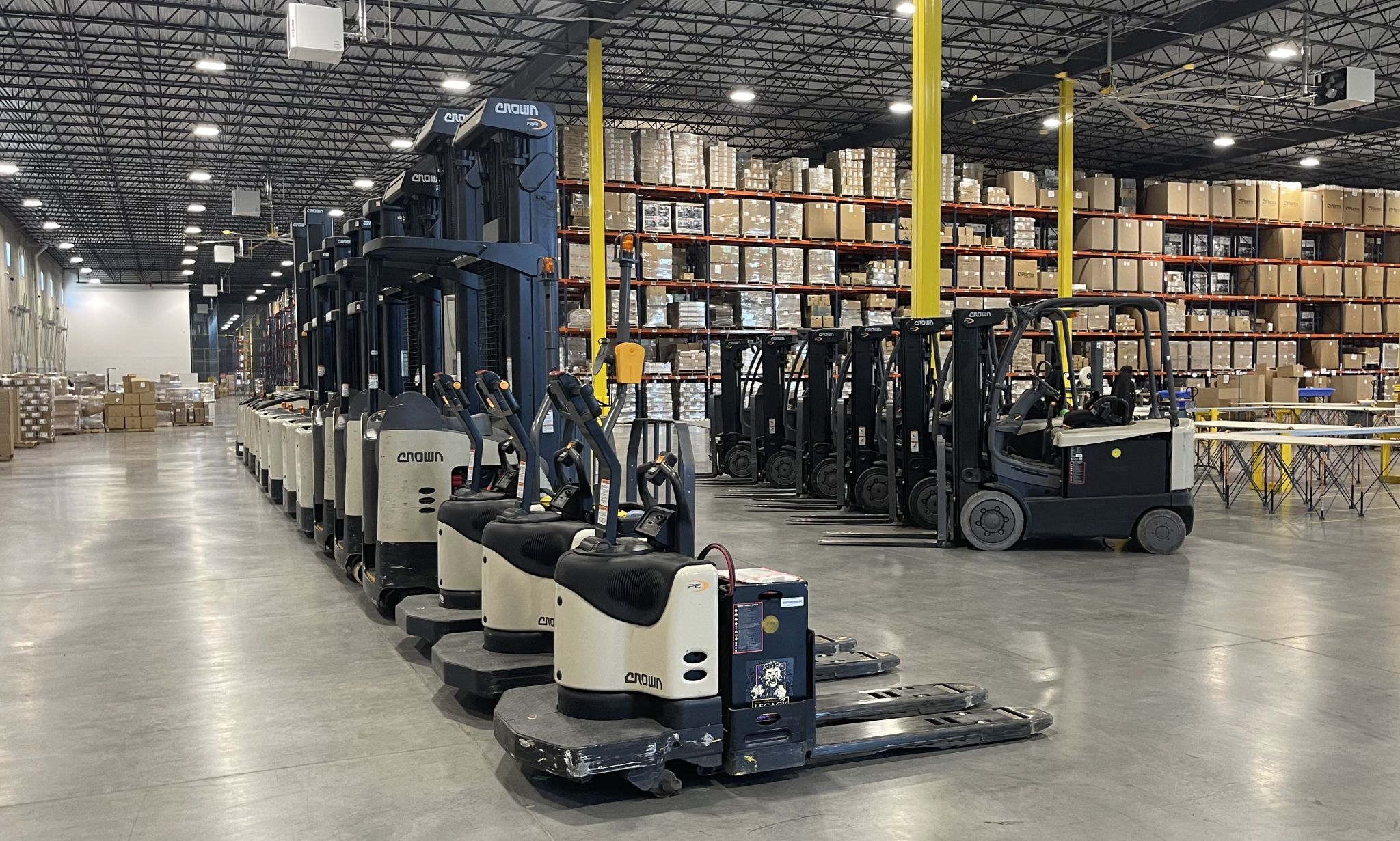 Forklifts and pallet jacks on KSP's warehouse floor