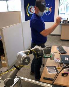 General Manager Mike testing artificial intelligence at the office