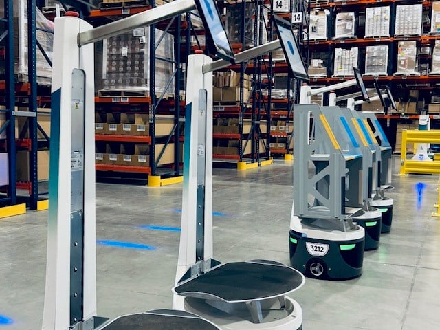 Locus picking robots lined up empty beside pallet racking on the KSP pick floor in Brooklyn Park