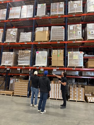 logistics partnership agreement handshake at warehouse office.