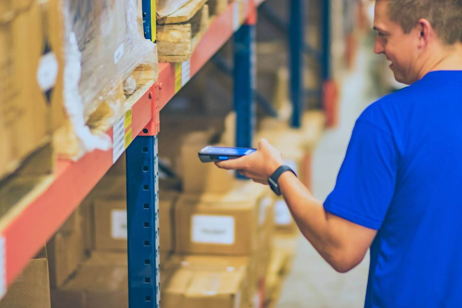 warehouse staff scanning inventory with barcode scanner